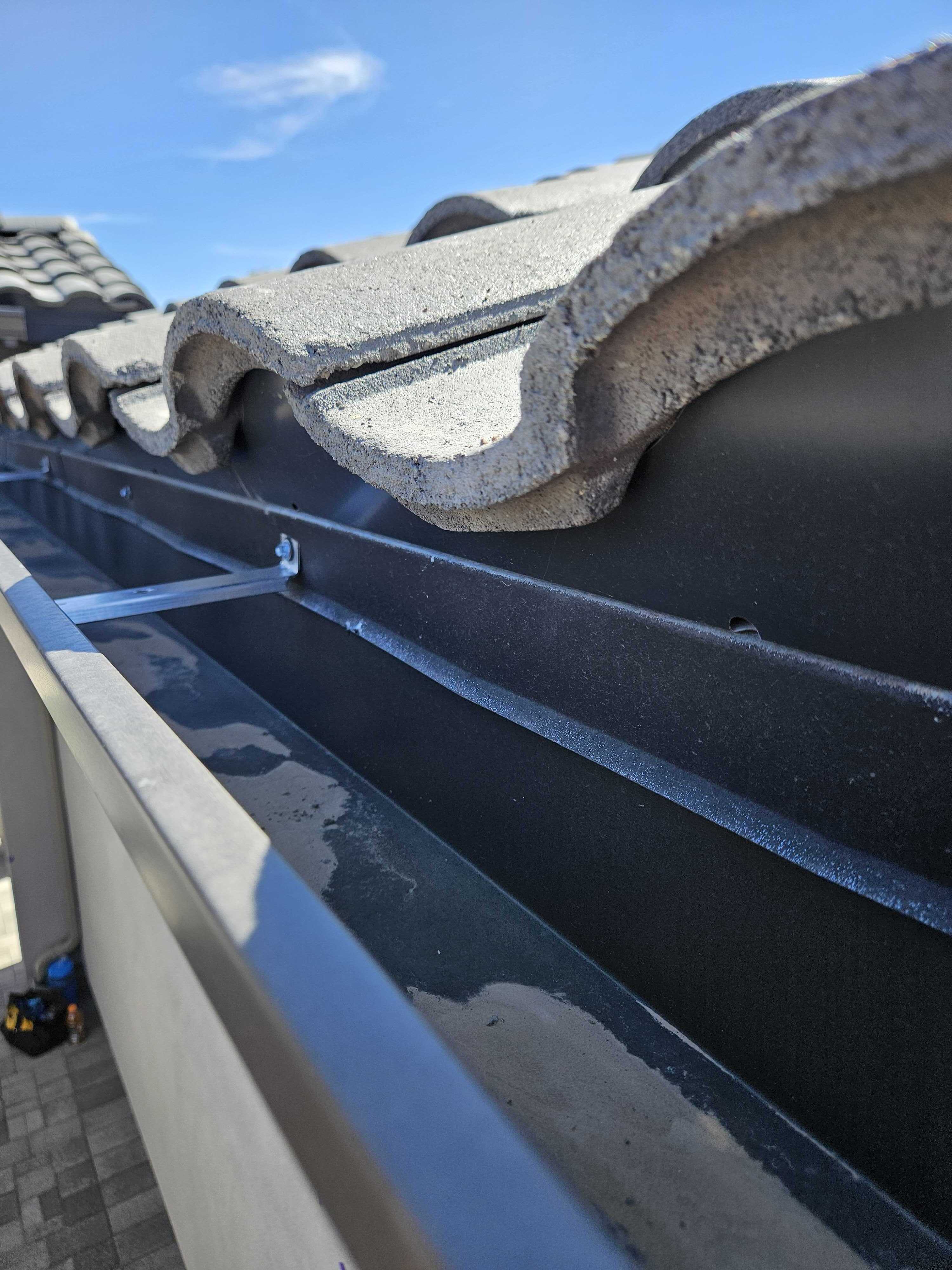 Inspector checking a residential roofline